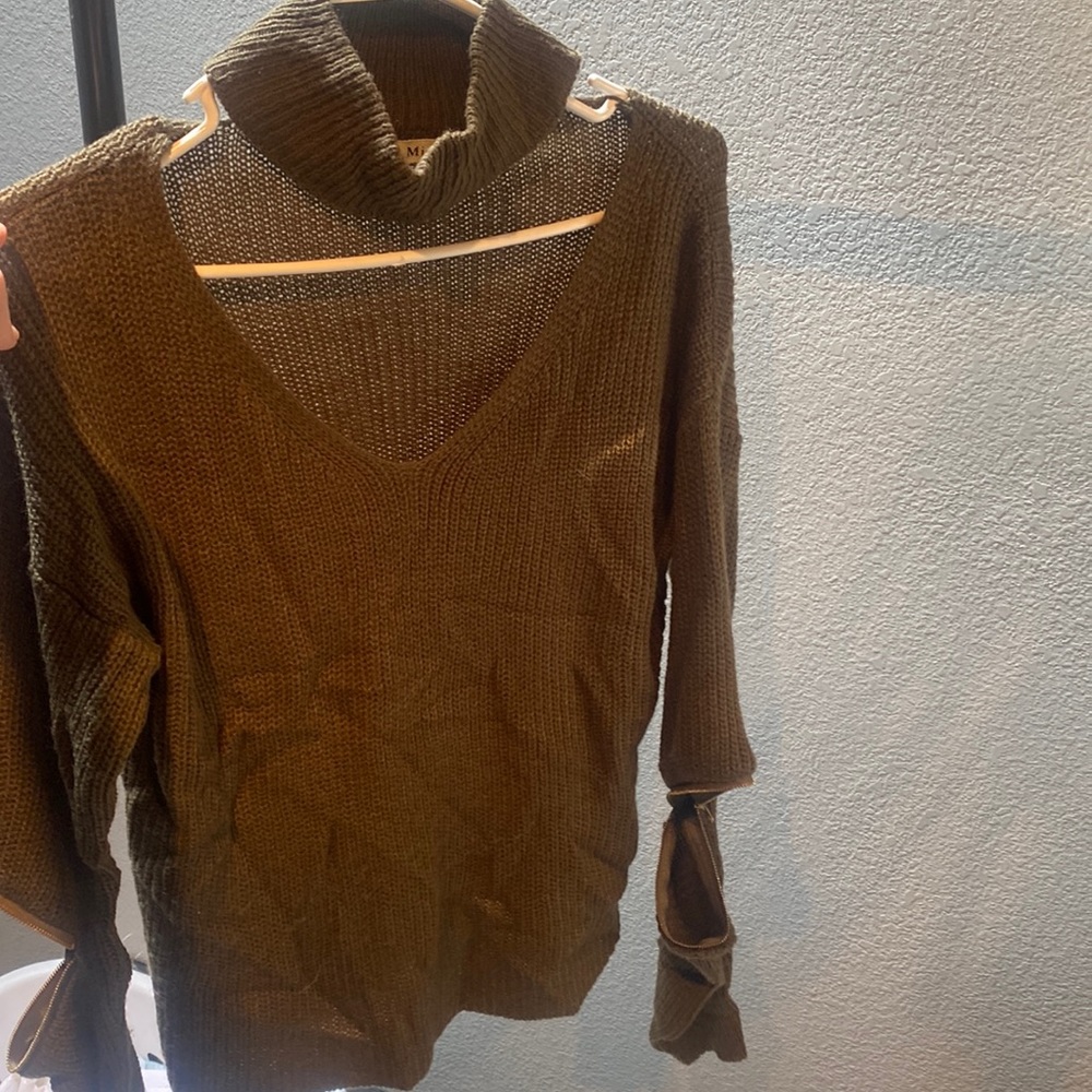 olive sweater with zipper detailed opening on the sleeve (at elbow)